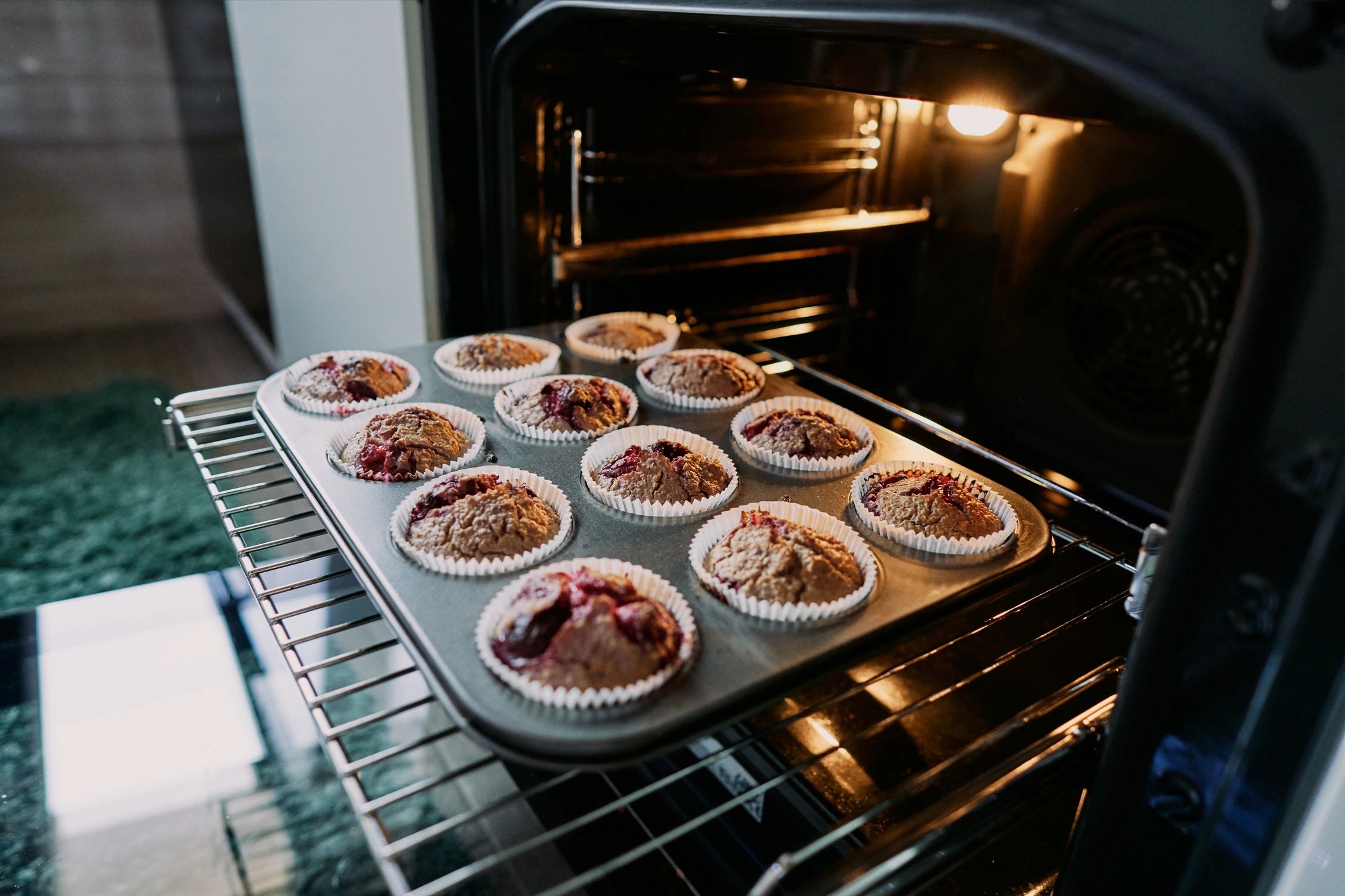 Fresh muffins on a baking tray