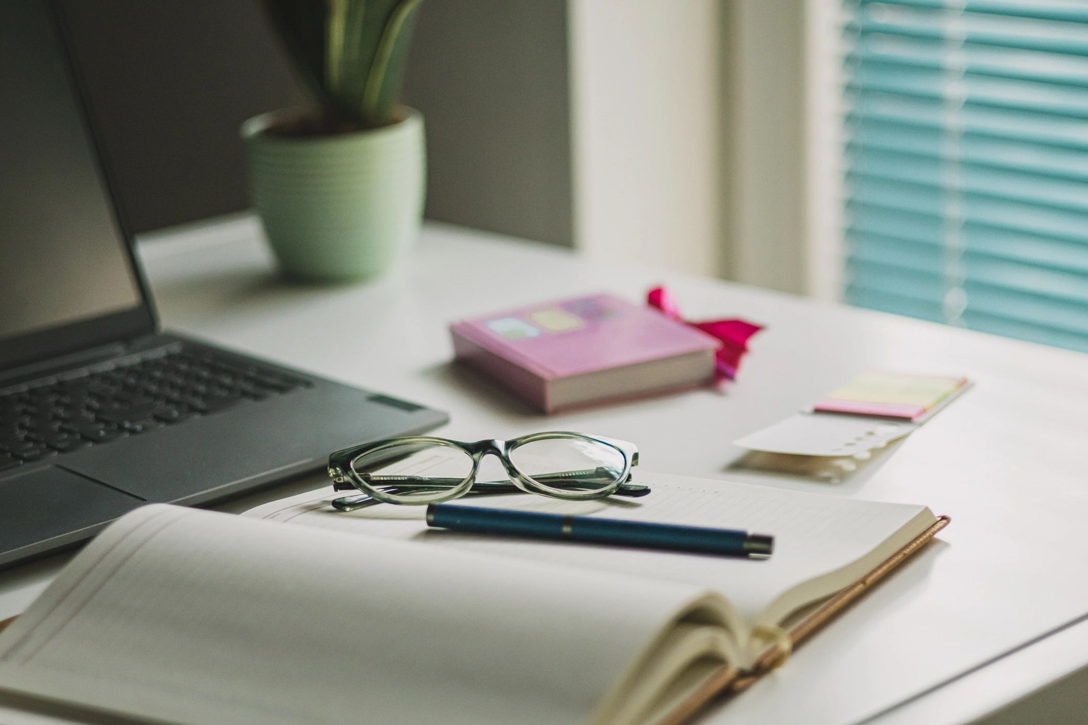 Creative branding workspace with laptop and desk accessories